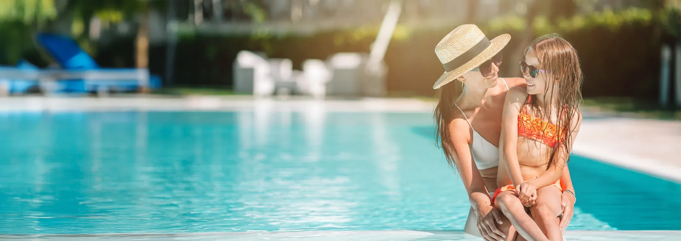 mother and daughter enjoying pool